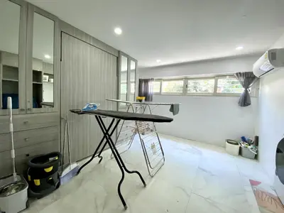 a kitchen with a table in the middle of a room at Seaview Duplex Home - Panwa Beach - Baan Jayden in Phuket Town