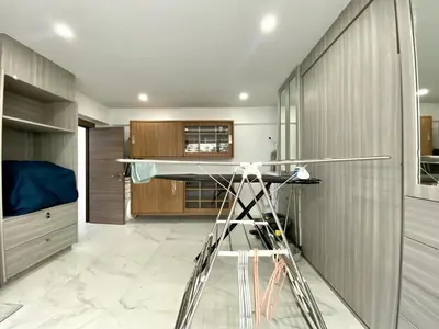 a kitchen with a glass table and a ladder at Seaview Duplex Home - Panwa Beach - Baan Jayden in Phuket Town
