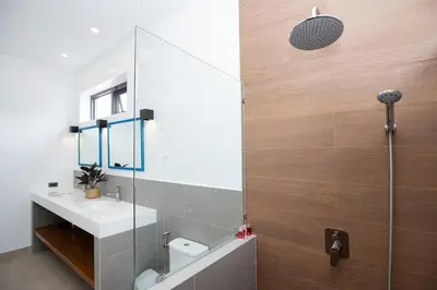 a bathroom with a sink and a shower at Villa Malaki, pool villa 2 bedrooms at rawai in Rawai Beach