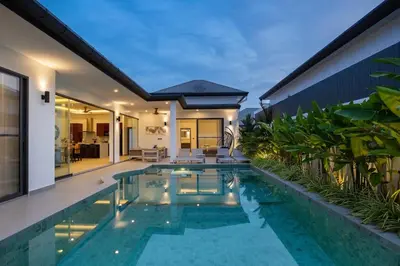 a swimming pool in the backyard of a villa at Villa Malaki, pool villa 2 bedrooms at rawai in Rawai Beach