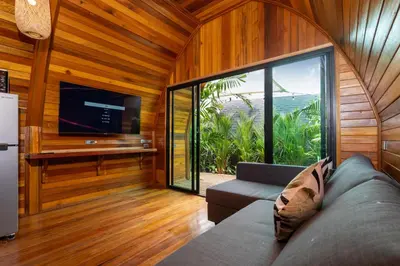 a living room with a couch and a flat screen tv at New 3BR Chalet-Style Villa Pasak Paradise 3, Private Pool, 10min drive to Laguna Phuket in Bang Tao Beach