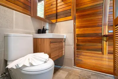 a bathroom with a toilet and a sink at New 3BR Chalet-Style Villa Pasak Paradise 3, Private Pool, 10min drive to Laguna Phuket in Bang Tao Beach