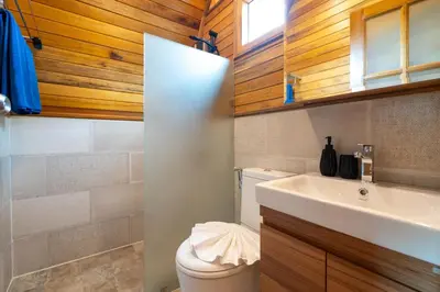 a bathroom with a white sink and a toilet at New 3BR Chalet-Style Villa Pasak Paradise 3, Private Pool, 10min drive to Laguna Phuket in Bang Tao Beach
