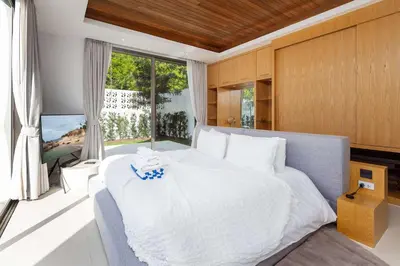 a bedroom with a large bed and a large window at Luxury 3BR Villa Wallaya with Private Pool in Bang Tao Beach
