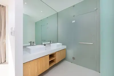 a bathroom with two sinks and a mirror at Luxury 3BR Villa Wallaya with Private Pool in Bang Tao Beach