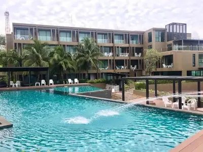 a large swimming pool in front of a building at The Pixel Cap Panwa Sea front Condominium - By Lovly in Ban Ao Makham