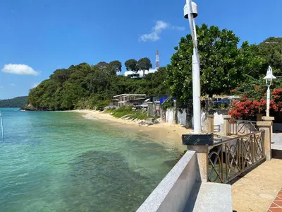 a view of a beach with a street light at The Pixel Cap Panwa Sea front Condominium - By Lovly in Ban Ao Makham