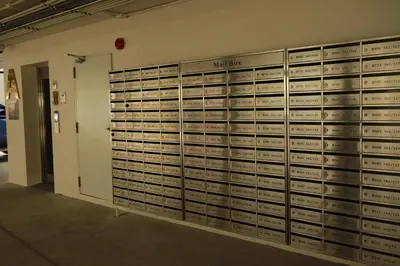 a wall of lockers in a parking garage at Premium 2BR near Kamala Beach, Pool, Gym & Shuttle Bus in Phuket Town