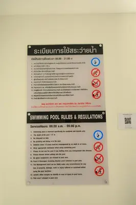 a sign that says swimming pool rules and regulations at Premium 2BR near Kamala Beach, Pool, Gym & Shuttle Bus in Phuket Town