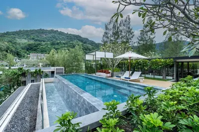 an infinity pool on the roof of a house at Luxury Penthouse 407sqm Beachfront and private pool in Phuket Town