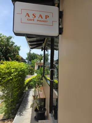 a sign for an asap care provider on a building at ASAP Boutique Phuket in Ban Thalat Choeng Thale