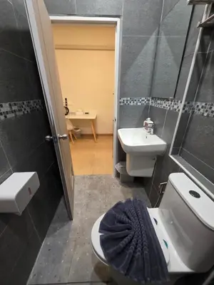 a bathroom with a toilet and a sink at ASAP Boutique Phuket in Ban Thalat Choeng Thale