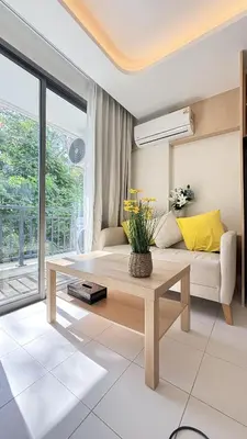 a living room with a couch and a table at Fantasea Kamala 1 BR Near Fantasea Show & Beach 505 in Phuket Town