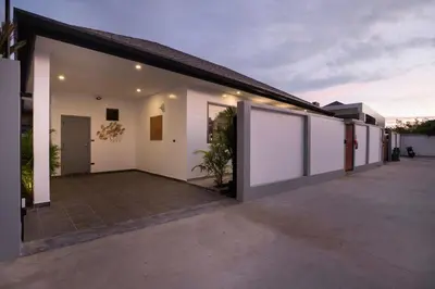 an empty courtyard of a house with white walls at Superb 3-bedrooms pool villa in Rawai, Naiharn villa Moana in Rawai Beach