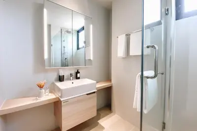 a bathroom with a sink and a shower at Solara Stays Phuket in Bang Tao Beach