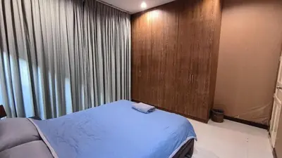 a bedroom with a bed and a large window at Rosemary Phuket in Ban Tha Rua