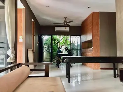 a living room with a ping pong table in it at Rosemary Phuket in Ban Tha Rua