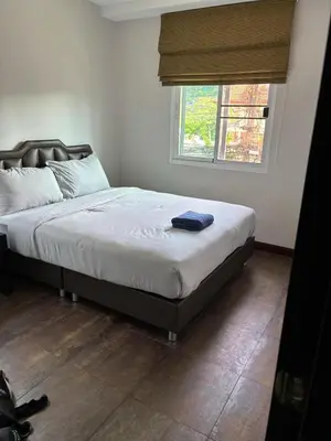 a bed sitting in a bedroom with a window at Modern 3-Bedroom Townhome in Kamala in Kamala Beach