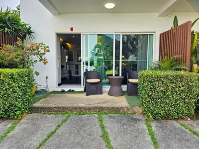 a house with two chairs and a table in it at Modern 3-Bedroom Townhome in Kamala in Kamala Beach