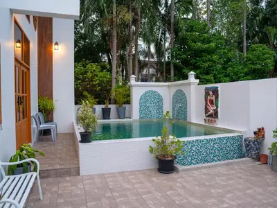 a swimming pool with a blue and white tile around it at 3 Bedroom Villa with Pool near Fitness street in Ban Klang