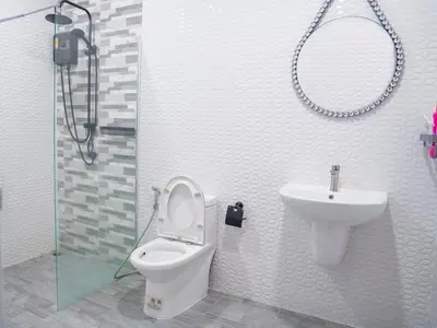 a bathroom with a toilet and a sink at 3 Bedroom Villa with Pool near Fitness street in Ban Klang