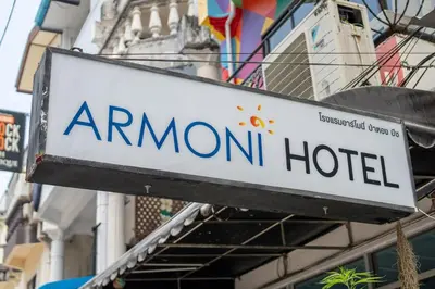 a sign for an amon hotel hanging from a building at Beachfront 4-BR House in Patong in Patong Beach
