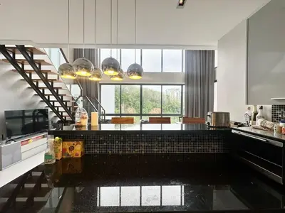 a kitchen with a counter top in a room at Luxury 2-Bedroom Penthouse with Seaview Kamala in Kamala Beach