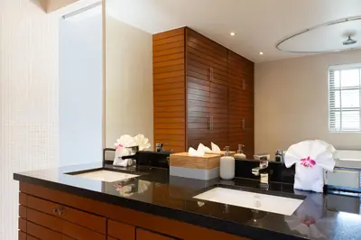 a bathroom with two sinks and a large mirror at The Residence Bangtao Villa 216 in Bang Tao Beach