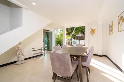 a dining room with a table and chairs at Jungle Villa-private pool, BBQ near Kamala beach in Kamala Beach