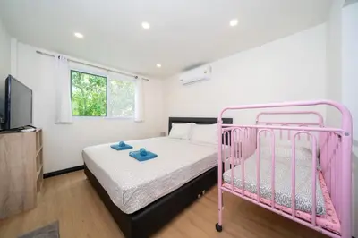 a pink bunk bed in a room with a tv at Jungle Villa-private pool, BBQ near Kamala beach in Kamala Beach