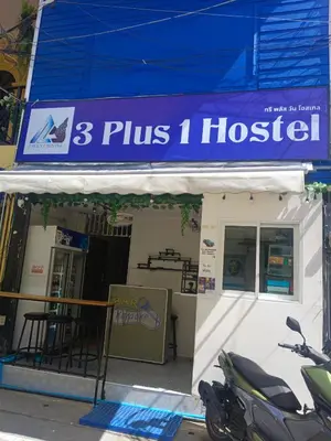 a motorcycle parked in front of a building at 3Plus1 Hostel Patong in Patong Beach