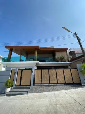 a house with a gate and a driveway at Mountain breeze villa phuket in Ban Bang Khu