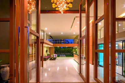 a hallway of a building with a chandelier at At the tree by fatimah Rawai R315 in Rawai Beach
