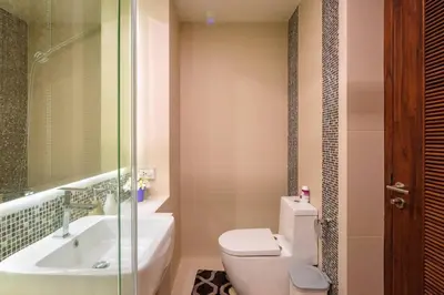 a bathroom with a toilet and a sink and a shower at At the tree by fatimah Rawai R315 in Rawai Beach