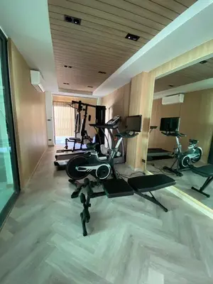 a gym with several exercise bikes in a room at Mountain breeze villa phuket in Ban Bang Khu