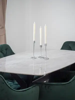 a table with three candles and green chairs at Leivi Villa 3 bedrooms in Rawai Beach