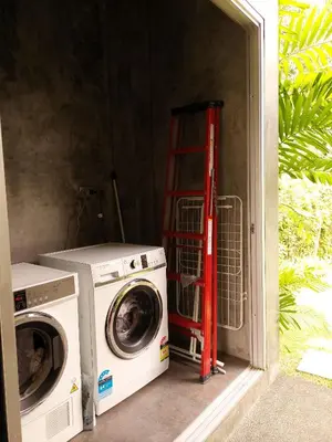 a washer and a washing machine in a room at 11 - Peaceful Escape on Naiyang Beach in Nai Yang Beach