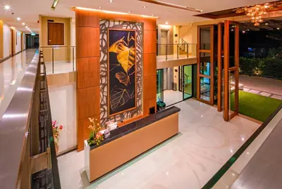 a lobby of a house with a painting on the wall at At the tree by fatimah Rawai 408 in Rawai Beach