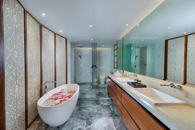 a bathroom with a large tub and a sink at The Aquila Villa in Kamala Beach