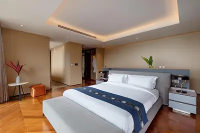 a large bedroom with a large white bed in it at The Aquila Villa in Kamala Beach