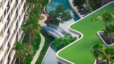 an aerial view of a resort with palm trees at Dcondo reef 99 in Kathu
