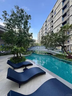 a swimming pool in the middle of a building at Dcondo reef 99 in Kathu