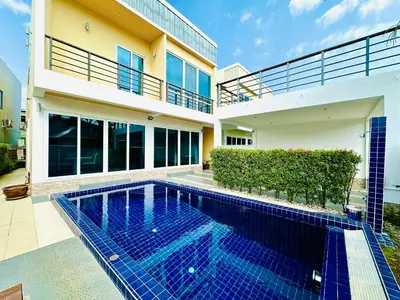 a swimming pool in front of a house at Villa 3bd & pool - Rawai - Nai Harn in Rawai Beach