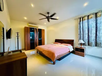a bedroom with a bed and a ceiling fan at Villa 3bd & pool - Rawai - Nai Harn in Rawai Beach