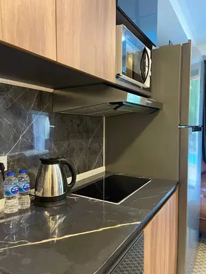 a tea kettle sitting on a counter in a kitchen at Palm Breeze View in Ban Mai Salae