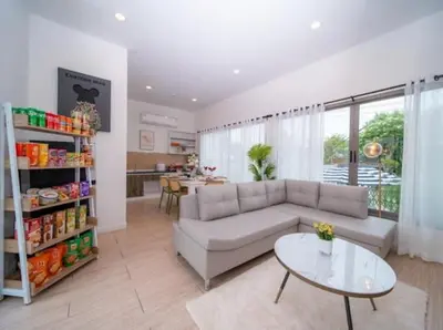 a living room with a couch and a table at Elegant 4BR Villa with Pool2 in Ban Bang La