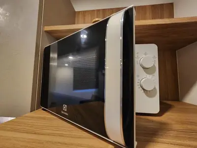 a microwave oven sitting on top of a counter at Cozy Apt-1BR T3-635 in Chalong