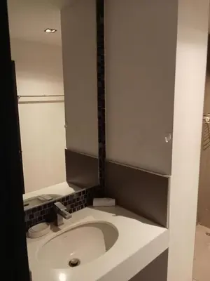 a bathroom with a white sink and a mirror at Well located condo-1BR T1-NV-203 in Chalong
