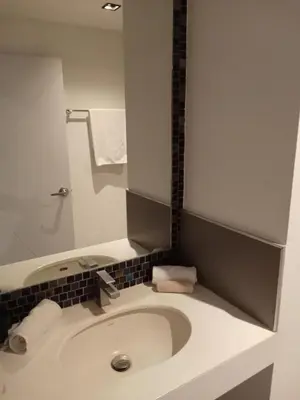 a bathroom with a white toilet with a sink at Modern Condo - 1BR T1-401 in Chalong