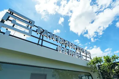 a sign for a pharmacy on top of a building at Cozy 1BdR Kamala Beach Pools on the Roof in Kamala Beach